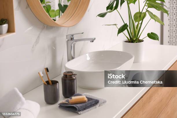 Stylish Vessel Sink On Light Countertop In Modern Bathroom Stock Photo - Download Image Now