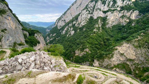 Amazing view of the Gizeldon gorge on the road to Dargavs village, North Ossetia, Russia. Amazing view of the Gizeldon gorge on the road to Dargavs village, North Ossetia, Russia. Impenetrable rocks and majestic mountains. north caucasus photos stock pictures, royalty-free photos & images