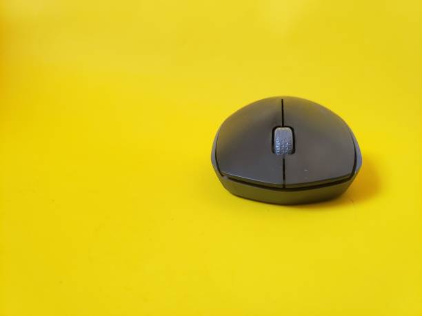 istock close up mouse one of the computer equipment on a yellow background 1332655116