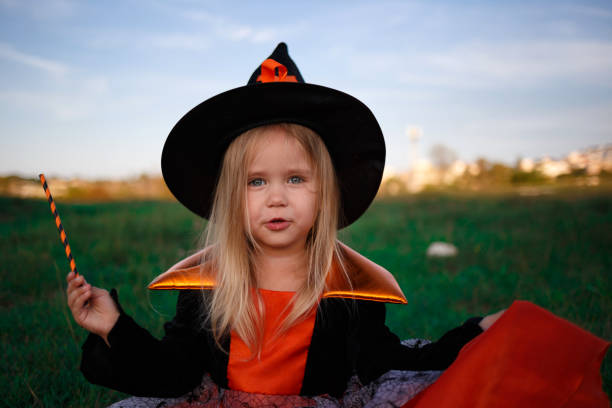 istock little cute girl dressed as a witch celebrates halloween 1332657174