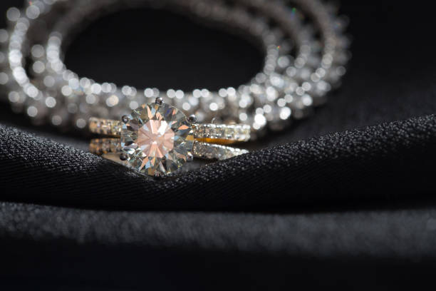 istock Jewellery ring against black fabric background 1332658165