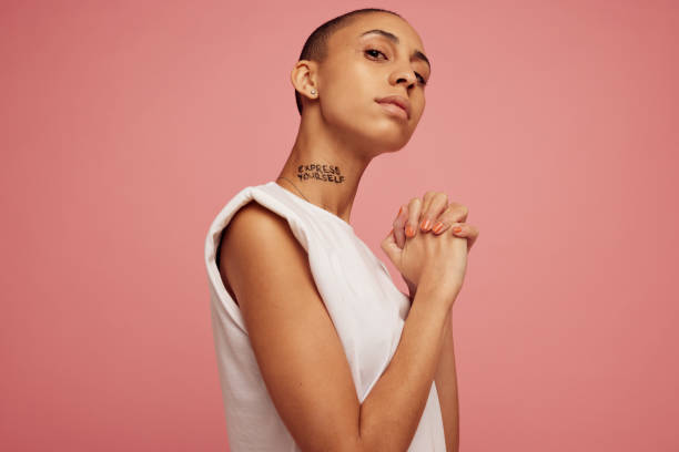 istock Androgynous woman staring at camera. 1332660443