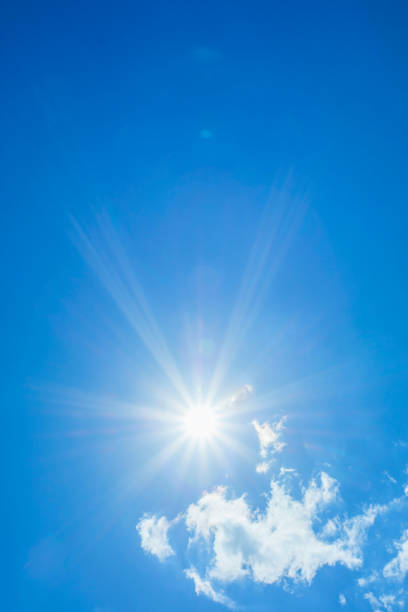 istock Bright sun with beautiful beams in the sky with light clouds 1332664277
