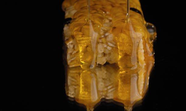 Honey pouring on a cereal bar