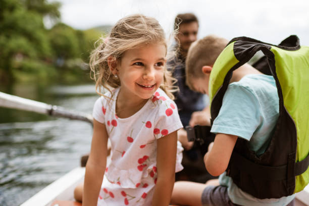 istock Young family enjoying boat ride 1332669604