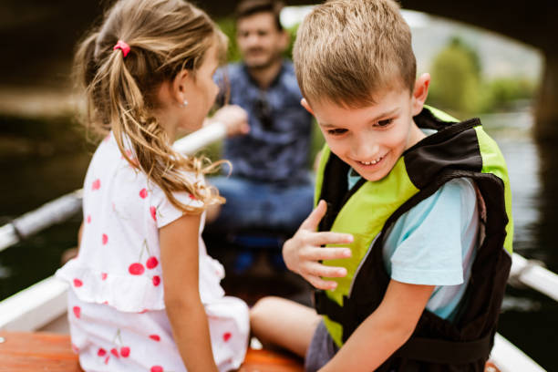 istock Young family enjoying boat ride 1332669880