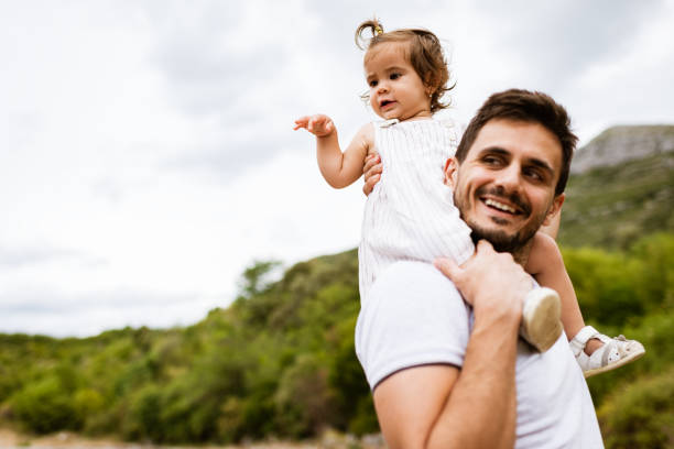 istock Father and daughter exploring nature 1332670063