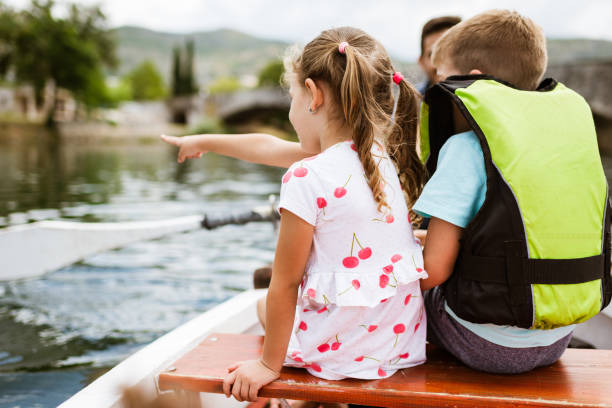 istock Young family enjoying boat ride 1332671242