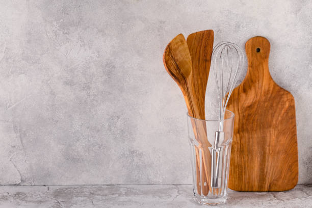 istock Kitchen utensils for eating and cooking on a light table 1332671314