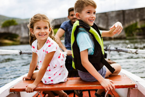istock Young family enjoying boat ride 1332671444