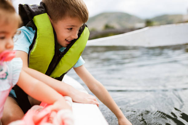 istock Young family enjoying boat ride 1332671503