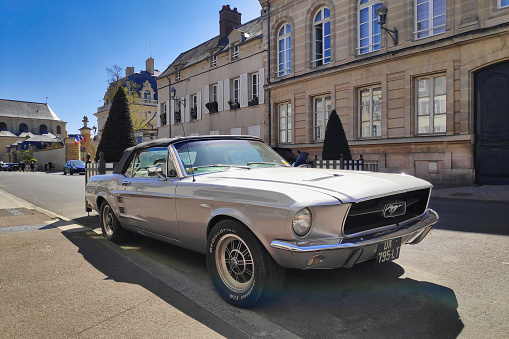 Chantilly, France - April 25 2021: Ford Mustang 68 convertible, the first-generation Ford Mustang was manufactured by Ford from March 1964 until 1973. The introduction of the Mustang created a new class of automobile known as the pony car.