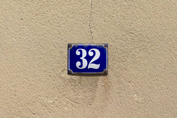 istock Number 32 on a blue enamel sign 1332682784
