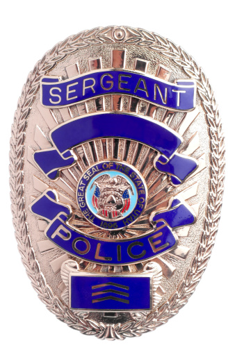 Close isolated shot of a police badge