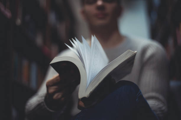 istock Student in the library searches for literature 1332686503