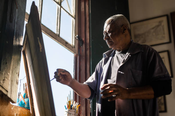 istock Under natural light, an elderly person composes his painting 1332686926