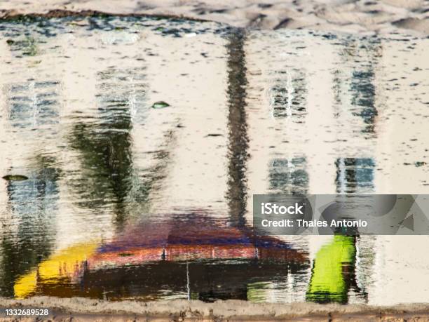 Reflection Of A Person In The Puddle Of Water At Ondina Beach Stock Photo - Download Image Now