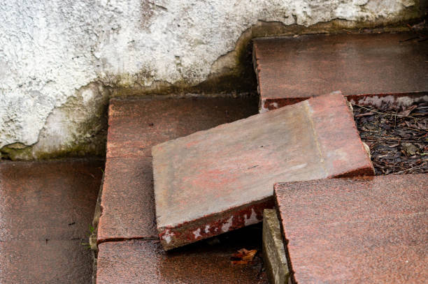 istock A dilapidated staircase. The stone slab came down from its place 1332689955