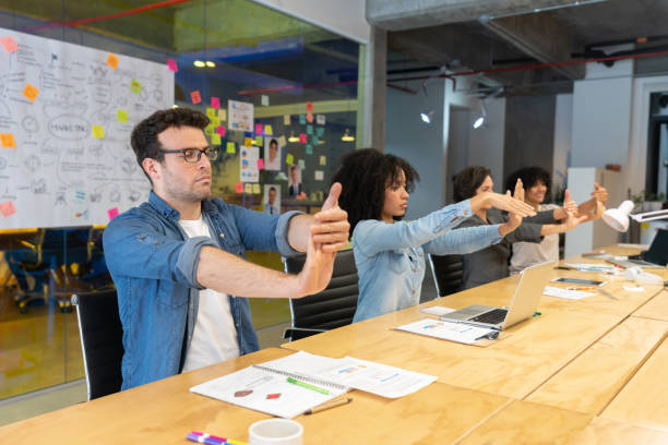 istock Group of workers stretching at the office during an active pause 1332693988