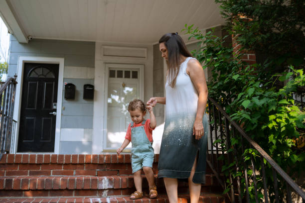 istock Latin mother and son walking around the house 1332696340