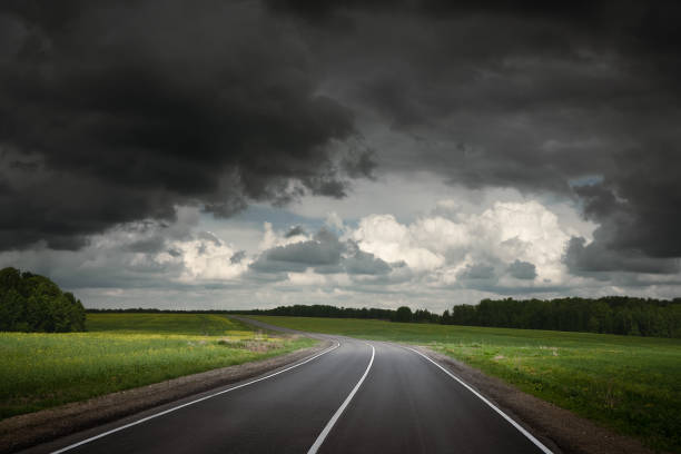 istock Summer country road before thunder storm. Dramatic sky. 1332698586