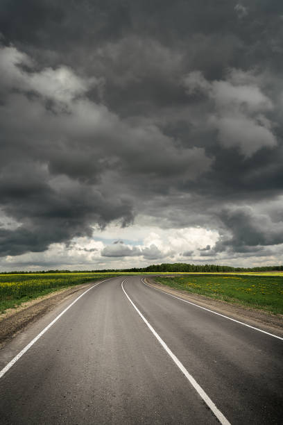 istock Summer country road before thunder storm. Dramatic sky. 1332698591