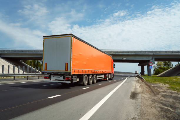 istock freight truck on the road. transportation. 1332699492
