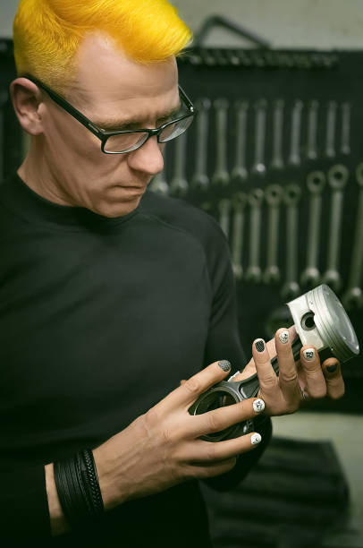 istock Bright style man repairing the engine. Manual worker's identity and diversity. 1332699527