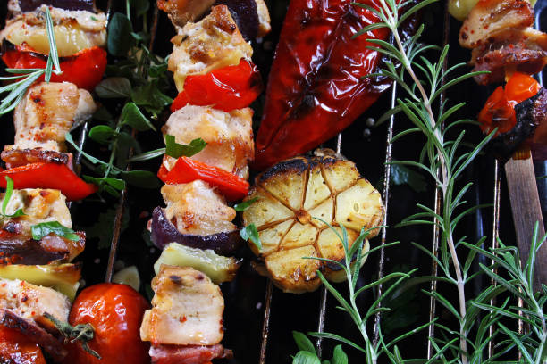 istock Grilled vegetable and meat skewers, top view 1332699646