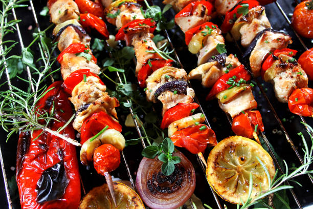 istock Grilled vegetable and meat skewers, top view 1332699737