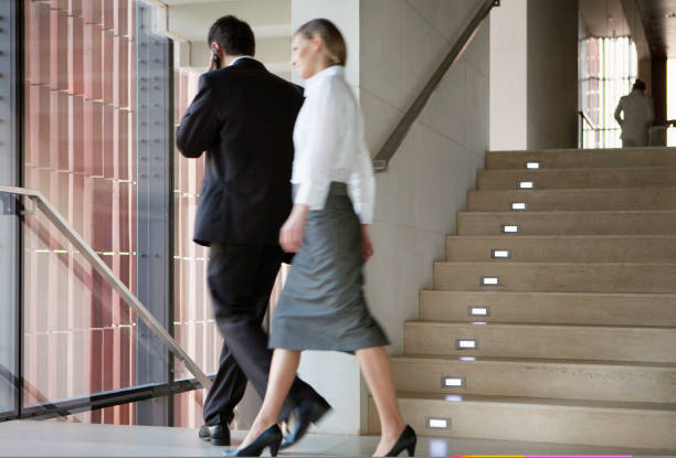 istock Business people talking at office corridor 1332700202