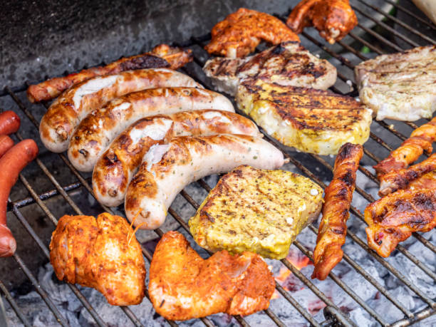 istock Bratwurst and steak on the charcoal grill