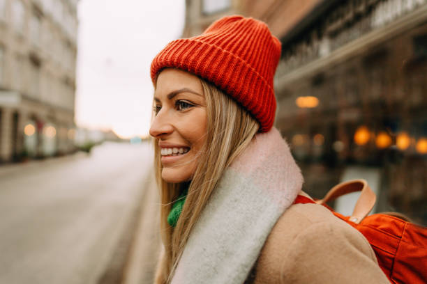 istock Young smiling woman on a city break 1332703903