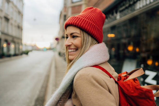istock Young smiling woman on a city break 1332704587