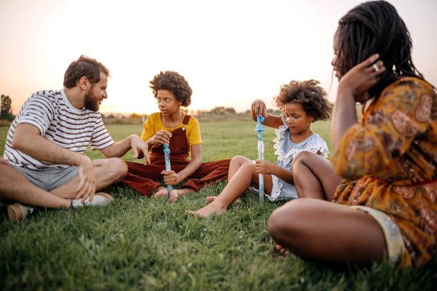 istock Family together playing in nature 1332706742