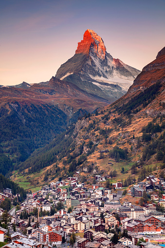 Image of iconic village of Zermatt, Switzerland with the Matterhorn in the background at beautiful sunny autumn sunrise.