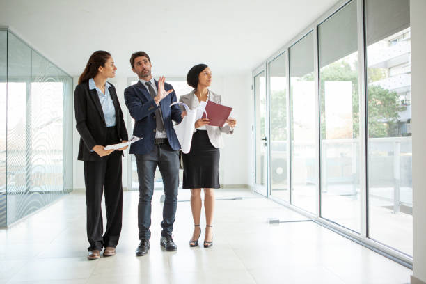 istock Latin male architect explaining project to businesswomen 1332707801