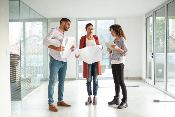 istock Full length portrait of architects and designers visiting project site 1332708405