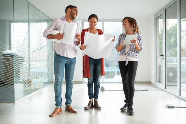 istock Full length portrait of architects and designers visiting project site 1332708457