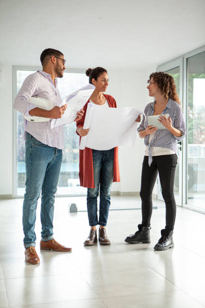 istock Full length portrait of architects and designers visiting project site 1332708466