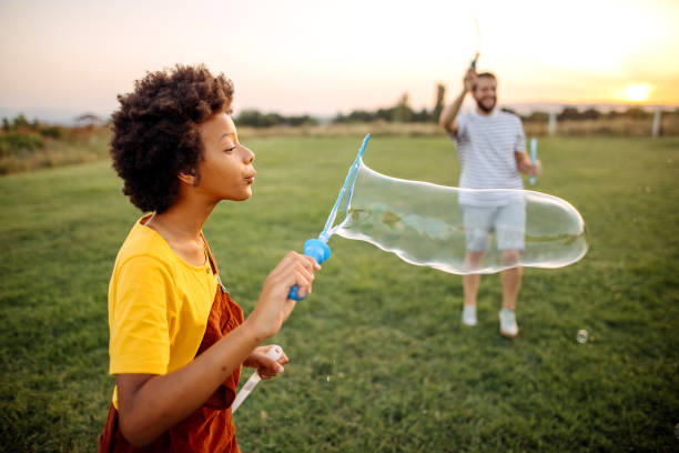 istock Family together playing in nature 1332708619