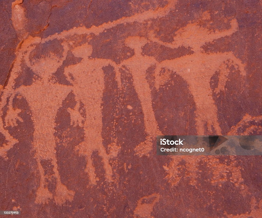 Actual Indian Petroglyphs of family Indian Writings on cliff located near Moab Utah Mother Father Pet two kids Cave Painting Stock Photo