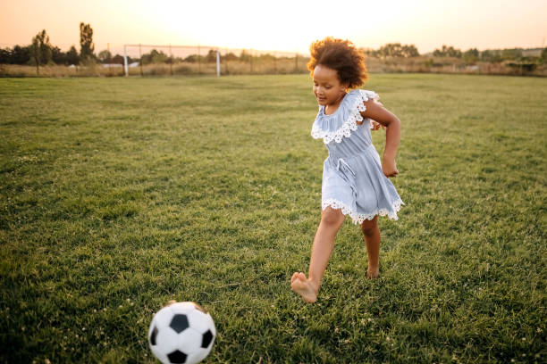 istock Kid running on sports field 1332709494