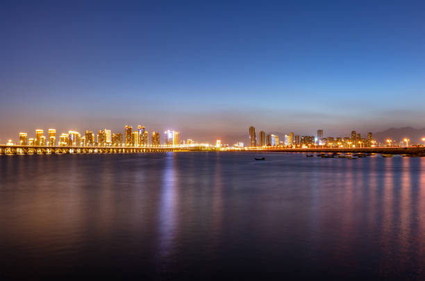 istock Skyline of night lights in modern coastal cities 1332709755