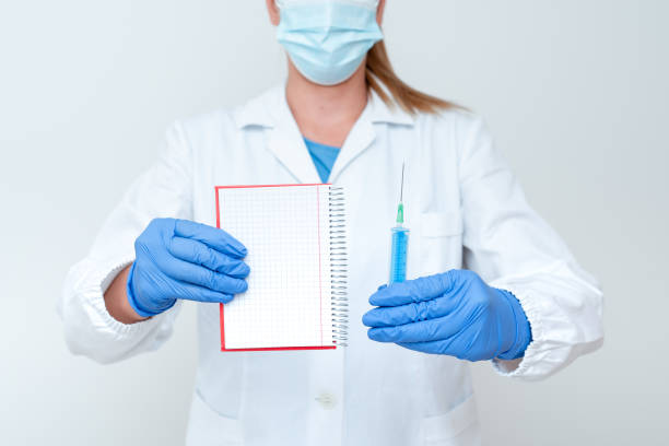 istock Preparing Medical Vaccine Presenting New Medicine Formulation Laboratory Experiment Presentations Science Discussions Wearing Occupation Workwear Protective Gears 1332712681