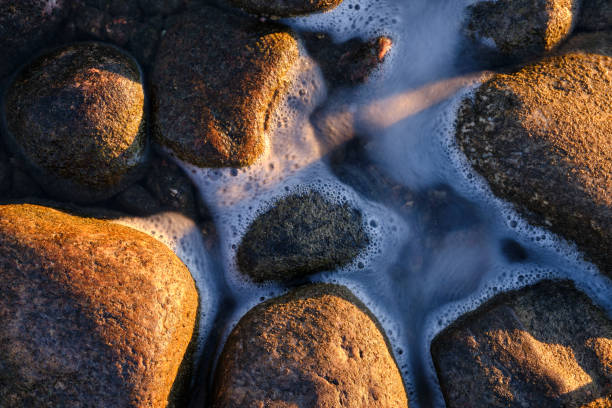 istock close up of a stone and water 1332718887