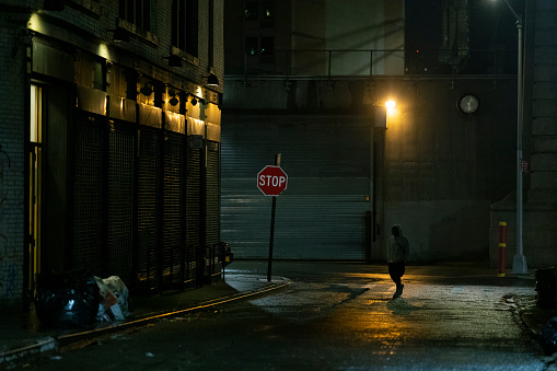 Dangerous looking street scene at night in New York City.