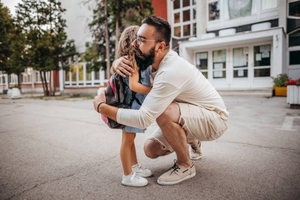 Are you happy Single father taking care of his daughter, leading his daughter to school first day of school stock pictures, royalty-free photos & images