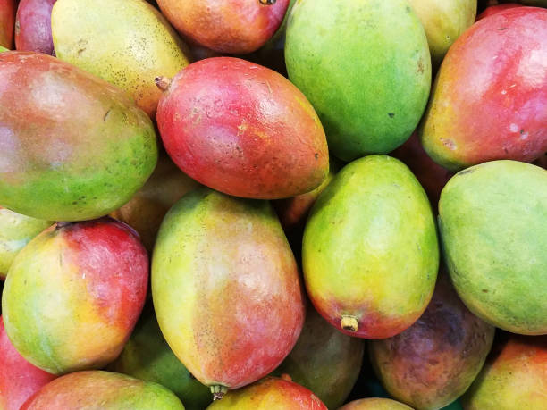 istock Background Of Colorful Mangos 1332725821