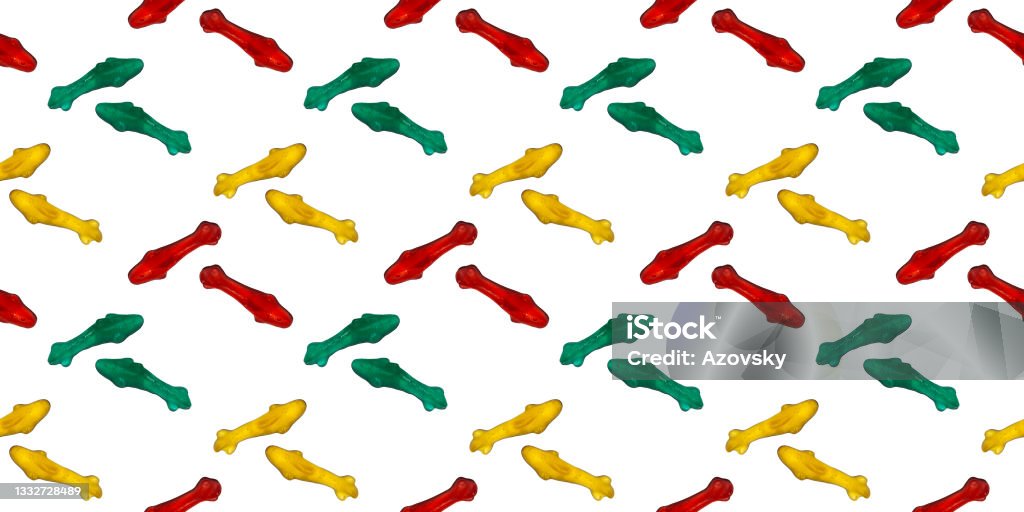 Seamless repeating pattern of marmalade eating sharks. Banner or wallpaper of edible sea fish on a white background. Candy Stock Photo